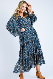 Model Jess wearing size 14 of the Floating By You Maxi in colour Ocean (Blue), from the front, showing the whole outfit