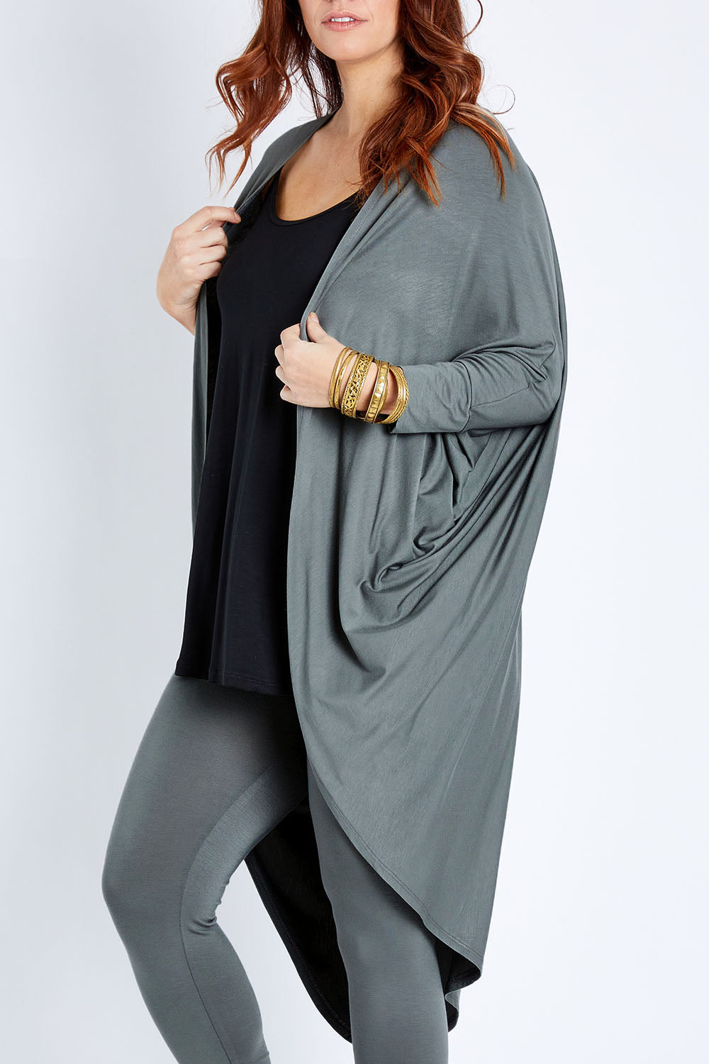 Model Laura wearing size 14 of the Falling For You Bamboo Cardi in colour Fern (Green), from the front, cropped image