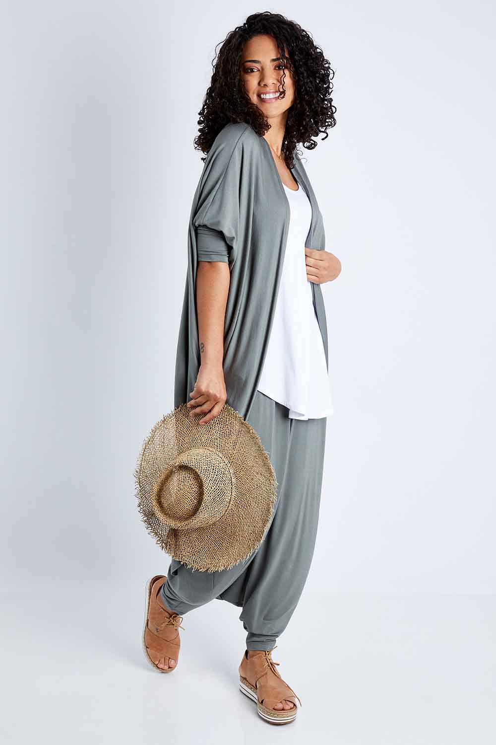 Model Pamela wearing size 10 of the Falling For You Bamboo Cardi in colour Fern (Green), from the front, showing the whole outfit