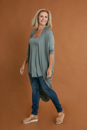 Model Sandy wearing size 10 of the Falling For You Bamboo Cardi in colour Fern (Green), from the front, showing the whole outfit