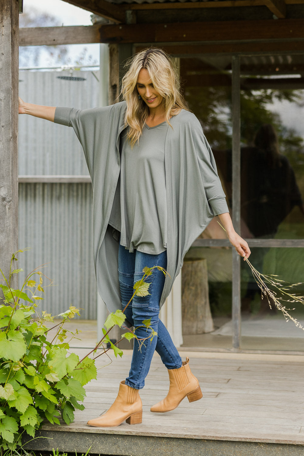 Model Tegan wearing size 10 of the Falling For You Bamboo Cardi in colour Fern (Green), from the front, showing the whole outfit