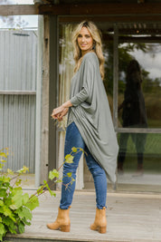 Model Tegan wearing size 10 of the Falling For You Bamboo Cardi in colour Fern (Green), from the front, showing the whole outfit