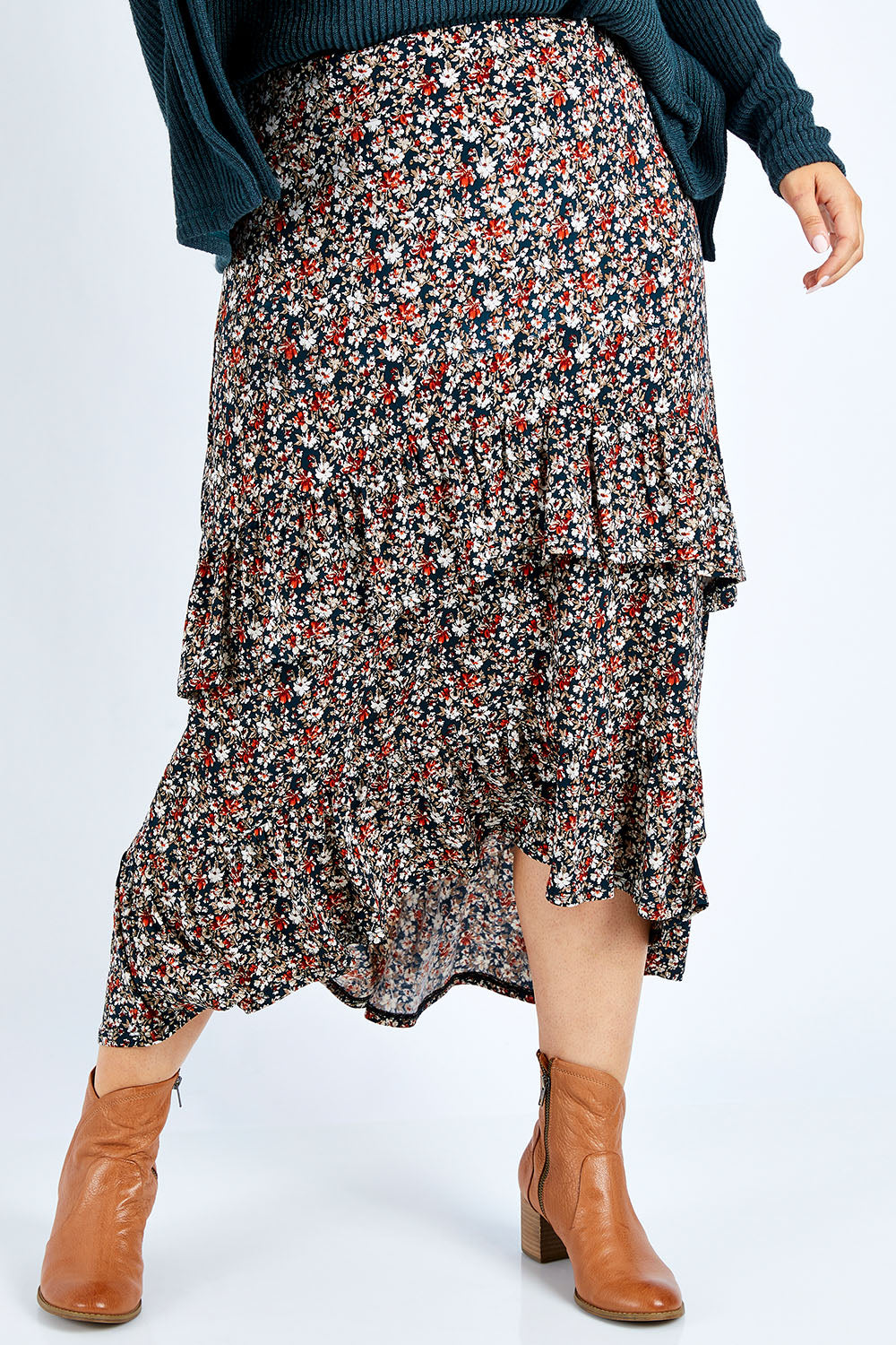 Model Jess wearing size 14 of the Tiers Of Delight Skirt in colour Ditsy (Green), from the front, cropped image