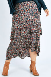 Model Jess wearing size 14 of the Tiers Of Delight Skirt in colour Ditsy (Green), from the front, cropped image