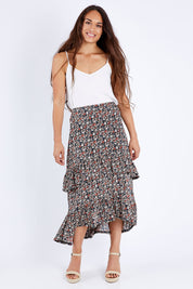 Model Larissa wearing size 10 of the Tiers Of Delight Skirt in colour Ditsy (Green), from the front, showing the whole outfit