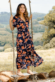 Model Ilona wearing size 10 of the Wild Garden Maxi Dress in colour Bluefleur (Blue), from the front, showing the whole outfit