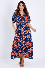 Model Laura wearing size 14 of the Wild Garden Maxi Dress in colour Bluefleur (Blue), from the front, showing the whole outfit
