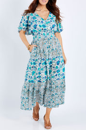 Model Laura wearing size 14 of the Tiers Of Joy Maxi Dress in colour Bluefleur (Blue), from the front, cropped image