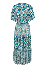 Product shot of the Tiers Of Joy Maxi Dress in colour Bluefleur (Blue), from the back