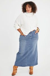 Model Alexis wearing size 16 of the Dusty Footprints Skirt in colour Denim (Blue), from the front, showing the whole outfit
