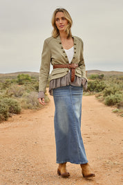 Model Tegan wearing size 10 of the Dusty Footprints Skirt in colour Denim (Blue), from the front, showing the whole outfit