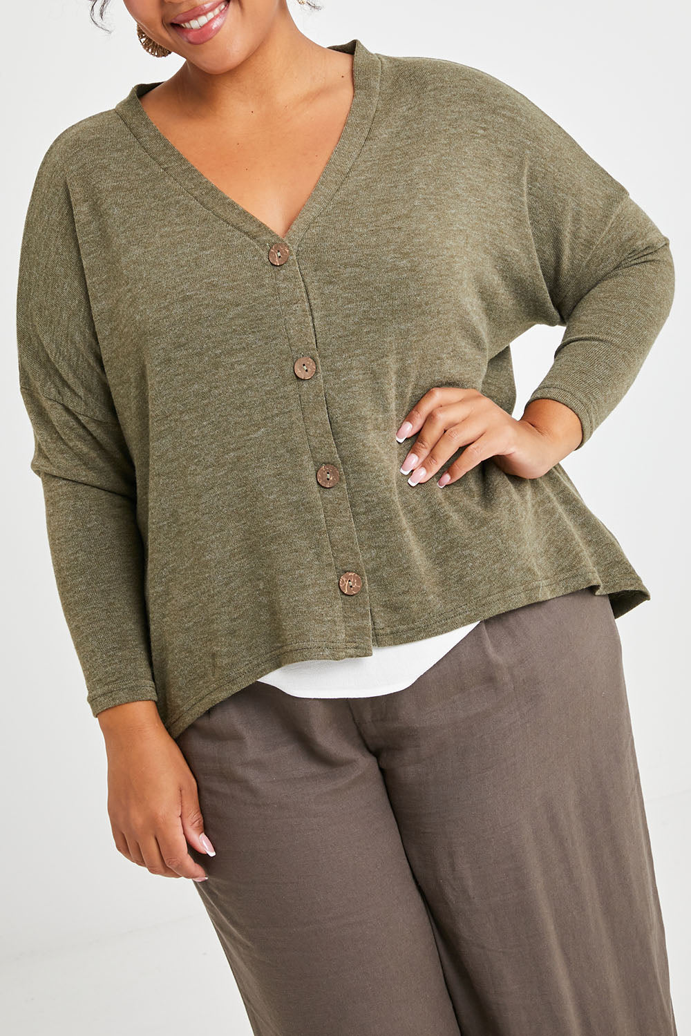Model Alexis wearing size 16 of the My Boyfriends Slouch Cardi in colour Olive (Green), from the front, cropped image