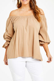 Model Laura wearing size 14 of the Twinkle In My Eye Off The Shoulder Top in colour Sand, from the front, cropped image