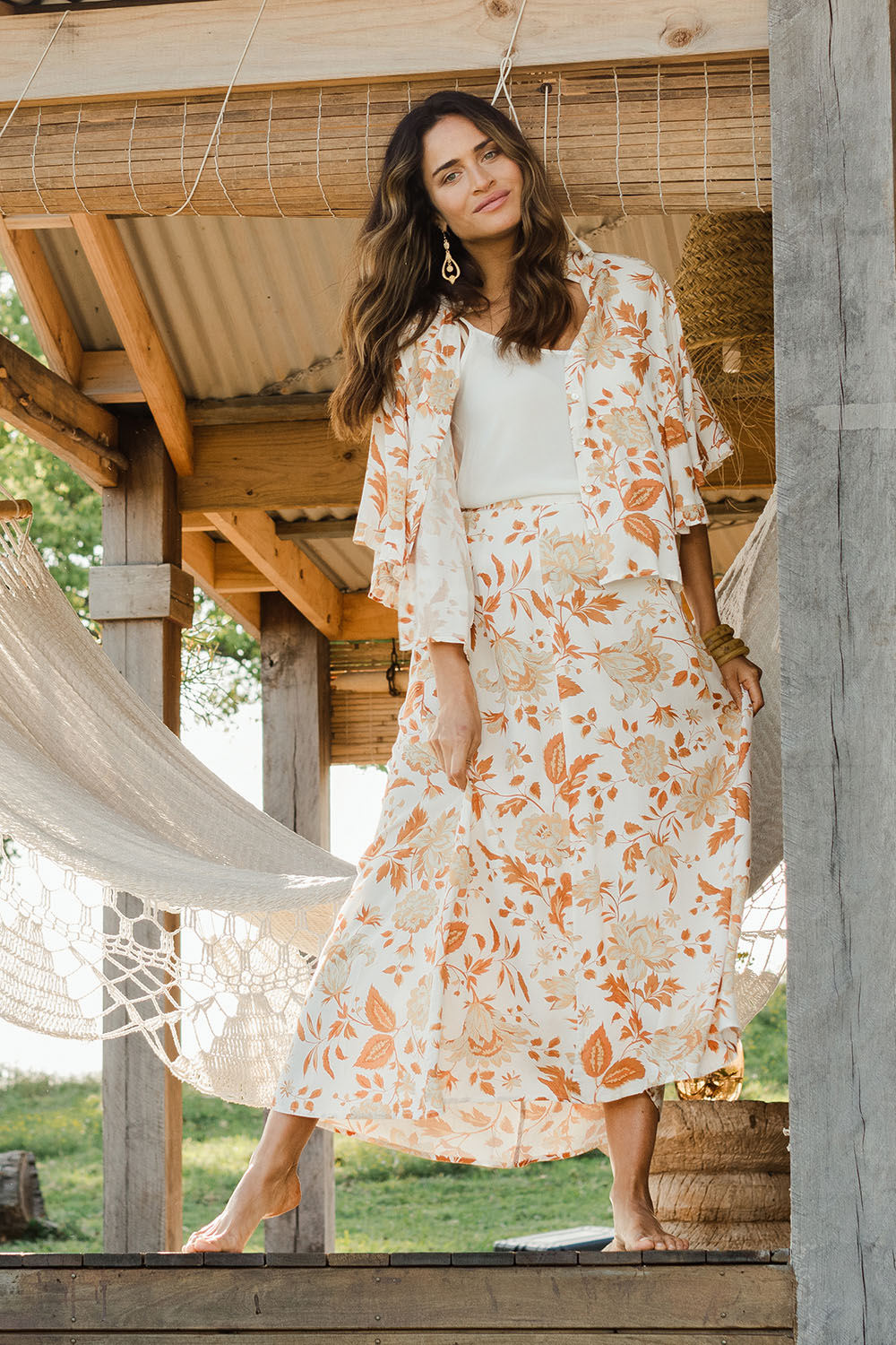 Model Ilona wearing size 10 of The Frills You Give Me Blouse in colour Rustfleur (White), from the front, showing the whole outfit