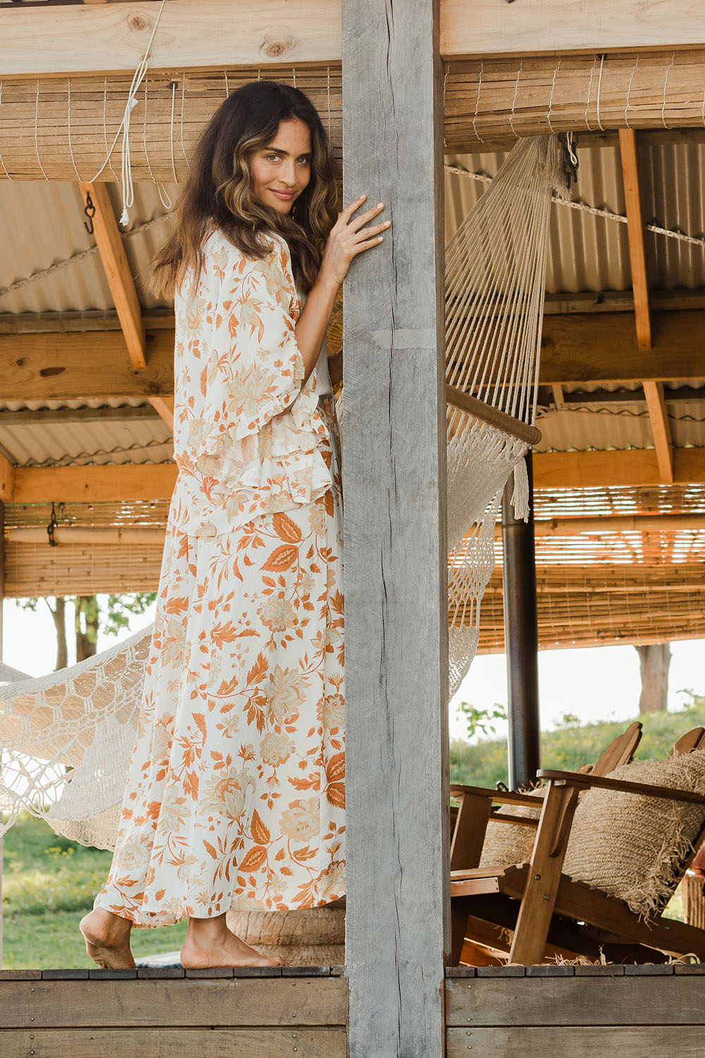 Model Ilona wearing size 10 of The Frills You Give Me Blouse in colour Rustfleur (White), from the front, showing the whole outfit