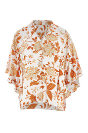 Product shot of The Frills You Give Me Blouse in colour Rustfleur (White), from the front