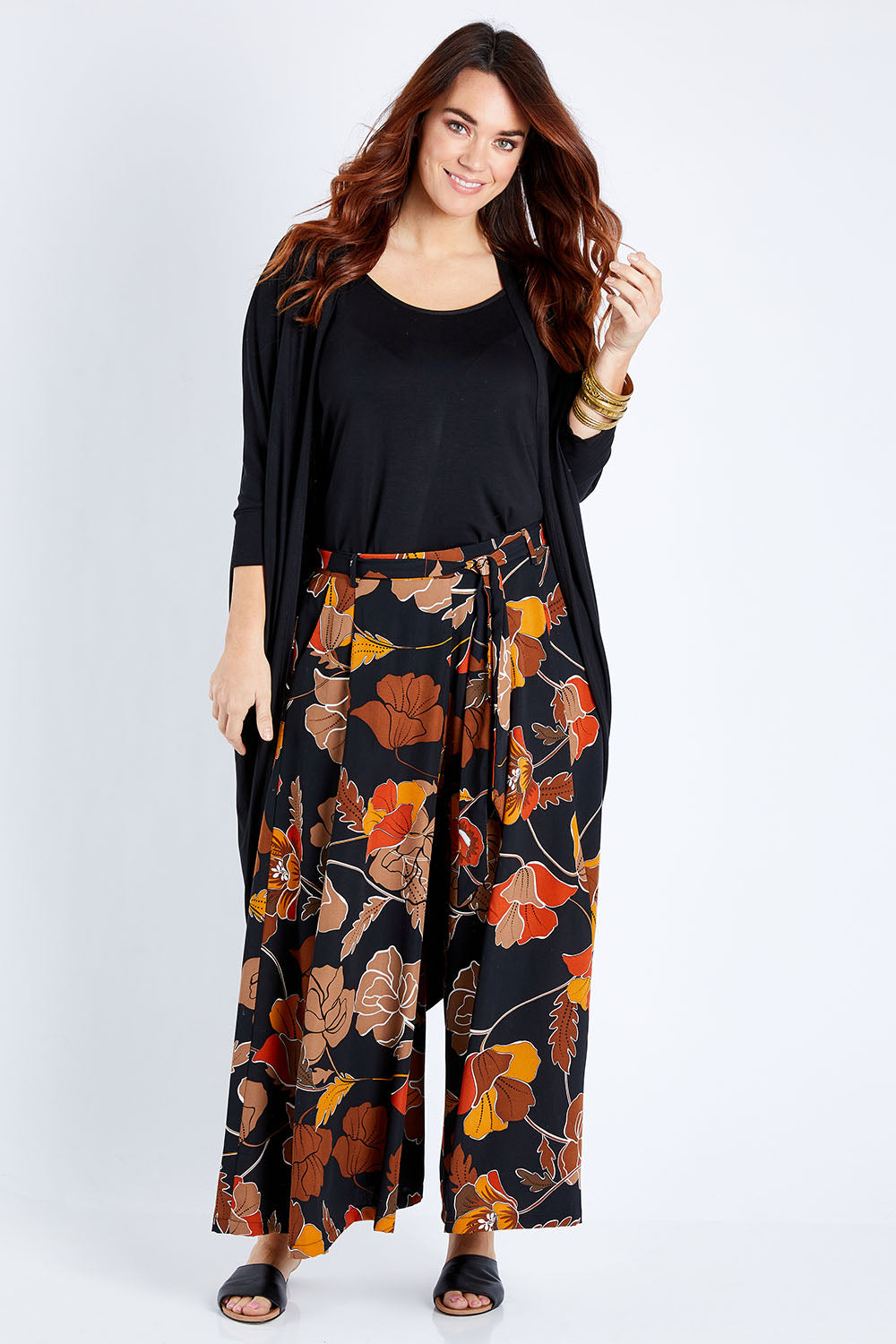 Model Laura wearing size 14 of the Walk This Way Wide Leg Pants in colour Blackrust (Black), from the front, showing the whole outfit