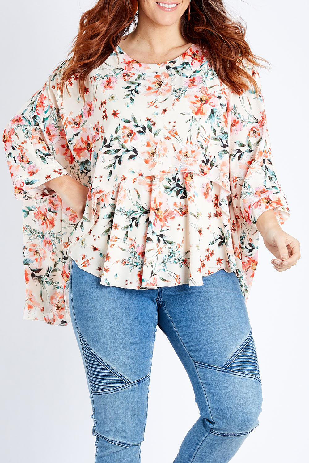 Model Laura wearing size 14 of the Garden Party Blouse in colour Floral (Pink), from the front, cropped image