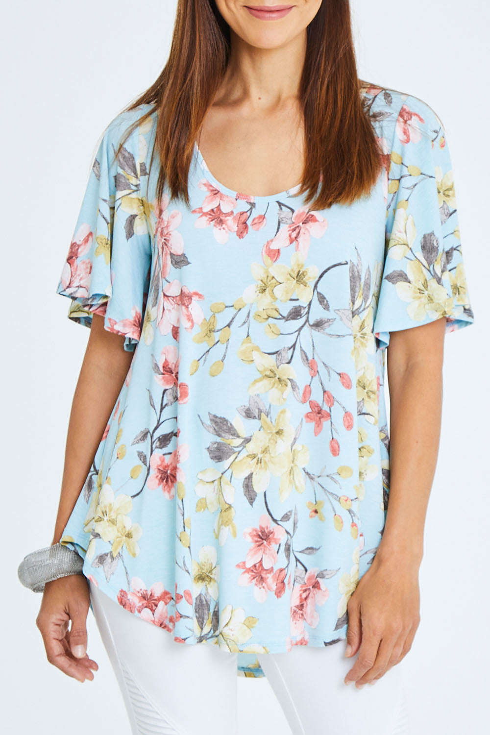 Model Cara wearing size 10 of the Free Falling Top in colour Blossom (Blue), from the front, cropped image