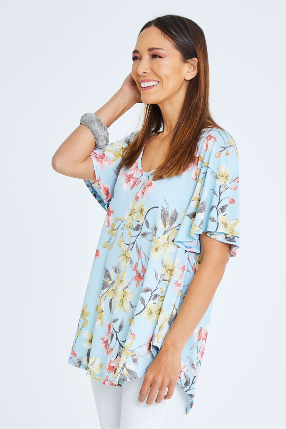 Model Cara wearing size 10 of the Free Falling Top in colour Blossom (Blue), from the front, cropped image