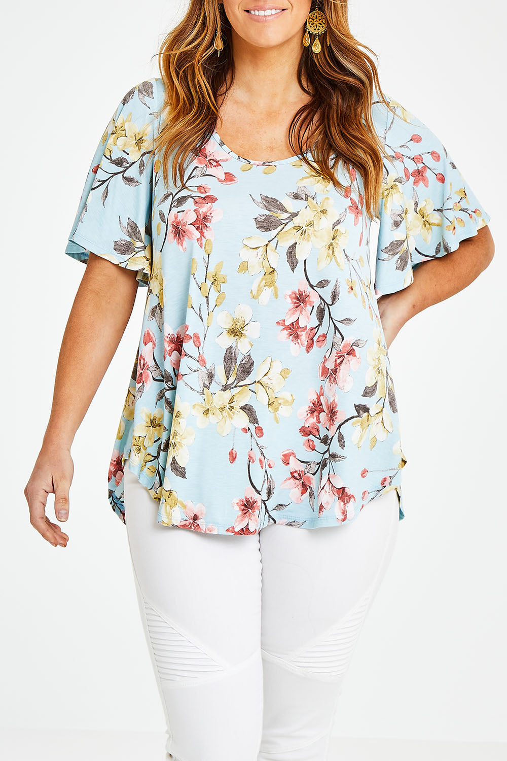 Model Laura wearing size 14 of the Free Falling Top in colour Blossom (Blue), from the front, cropped image