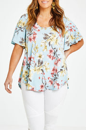 Model Laura wearing size 14 of the Free Falling Top in colour Blossom (Blue), from the front, cropped image