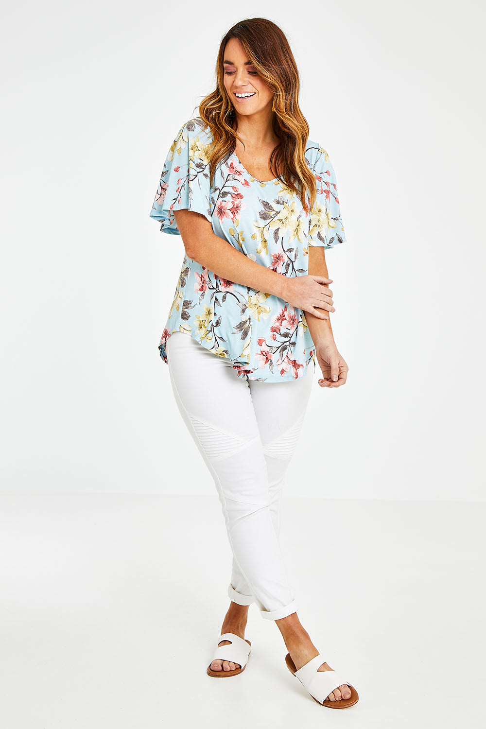 Model Laura wearing size 14 of the Free Falling Top in colour Blossom (Blue), from the front, showing the whole outfit