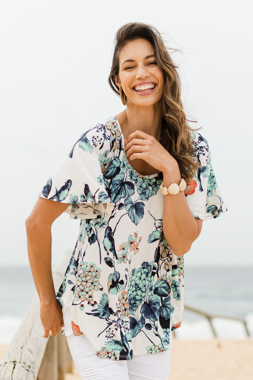 Model Amanda wearing size 10 of the Free Falling Top in colour Birdfleur (Blue), from the front, showing the whole outfit
