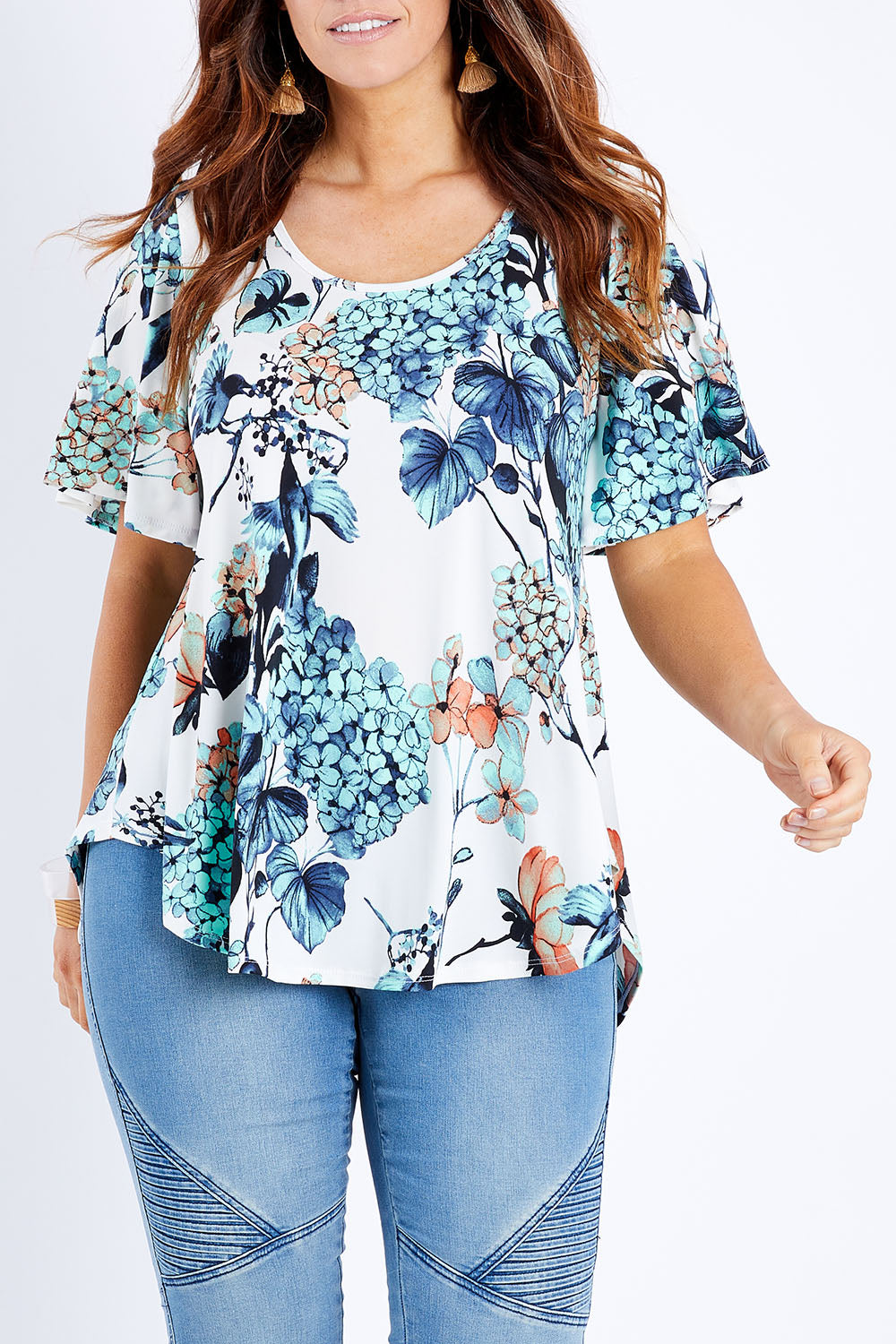 Model Laura wearing size 14 of the Free Falling Top in colour Birdfleur (Blue), from the front, cropped image