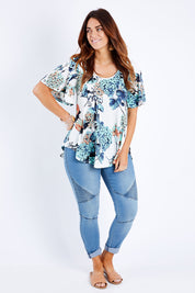 Model Laura wearing size 14 of the Free Falling Top in colour Birdfleur (Blue), from the front, showing the whole outfit