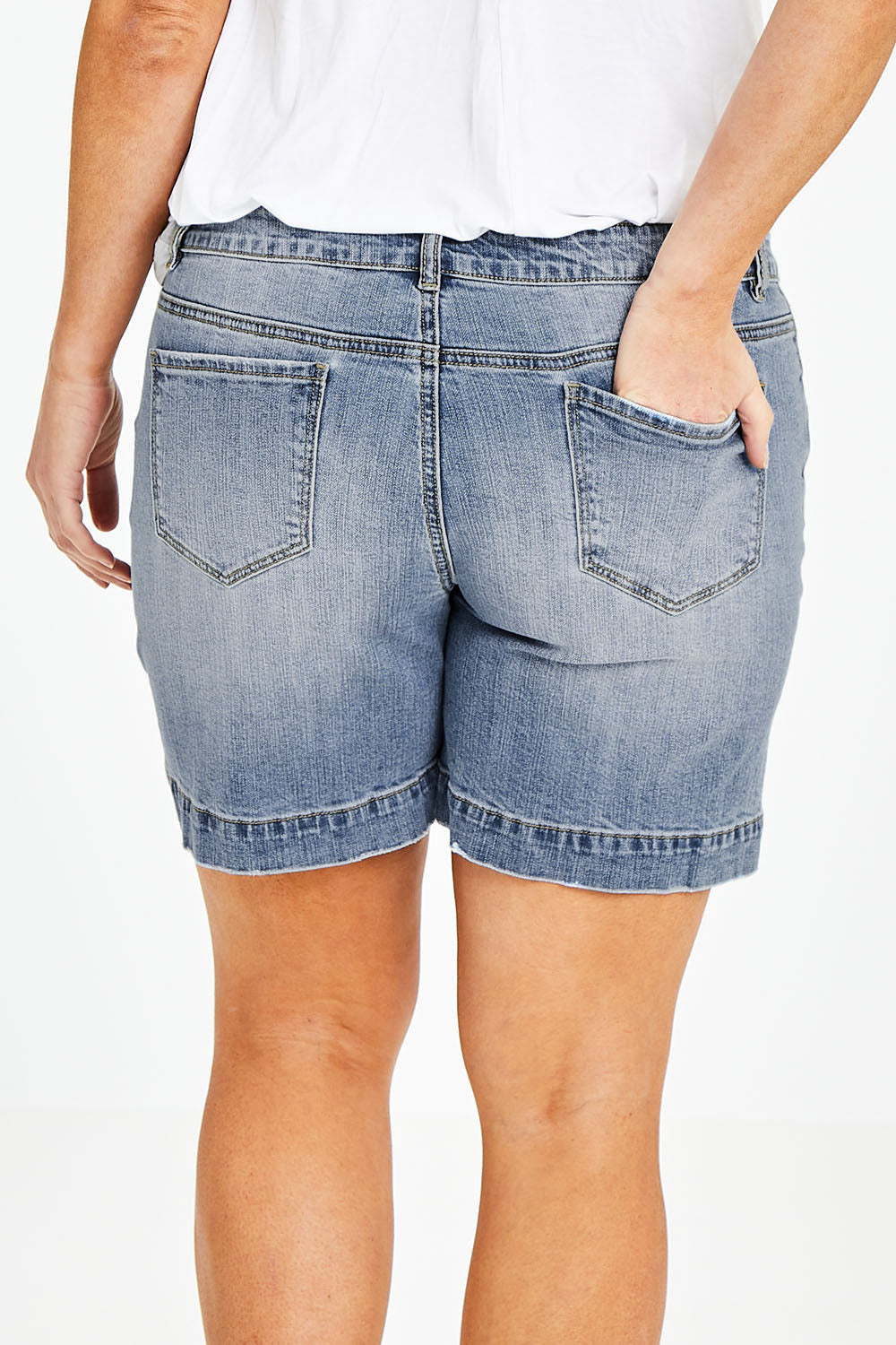 Model Laura wearing size 14 of the Youre Always There For Me Boyfriend Shorts in colour Denim (Blue), from the back