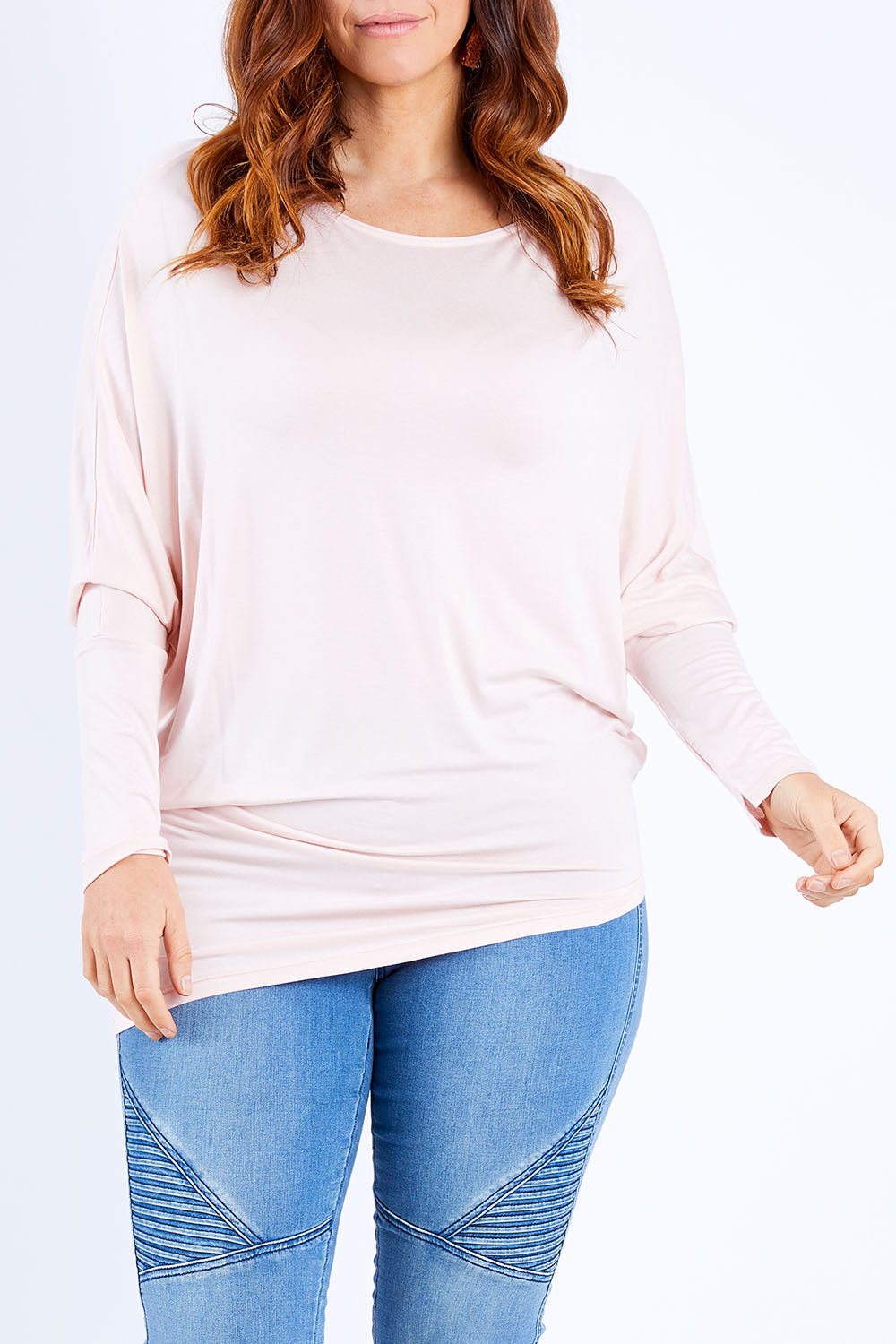 Model Laura wearing size 14 of the Softly Swinging Bamboo Batwing Top in colour Ballet (Pink), from the front, cropped image