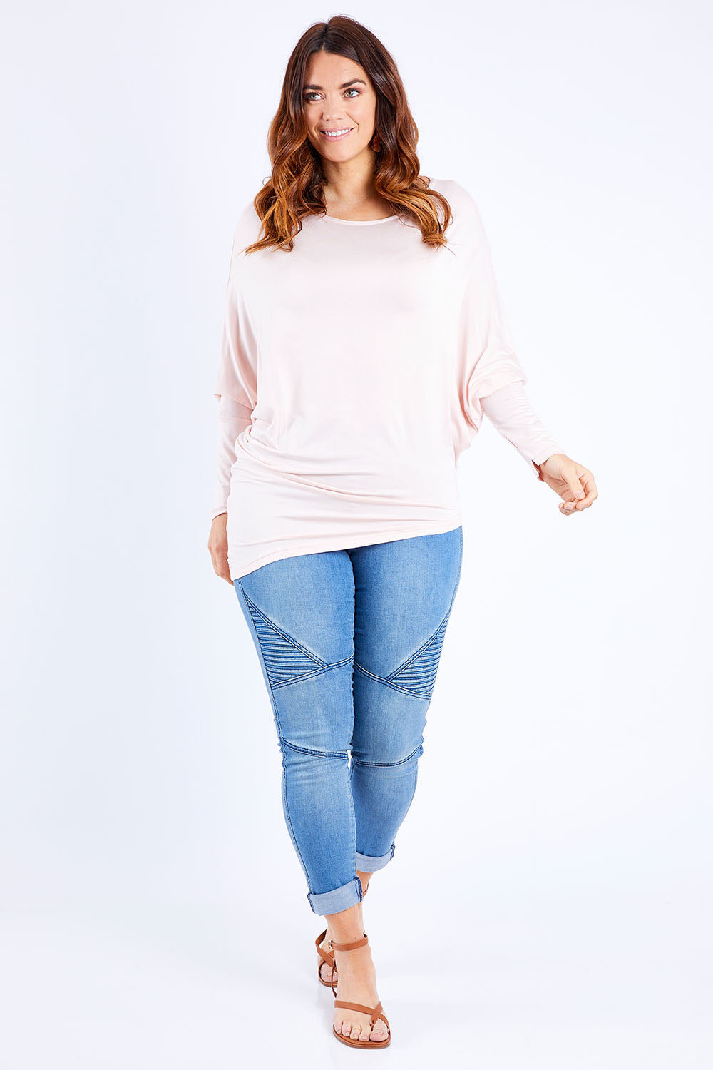 Model Laura wearing size 14 of the Softly Swinging Bamboo Batwing Top in colour Ballet (Pink), from the front, showing the whole outfit