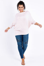 Model Sasha-Lee wearing size 16 of the Softly Swinging Bamboo Batwing Top in colour Ballet (Pink), from the front, showing the whole outfit