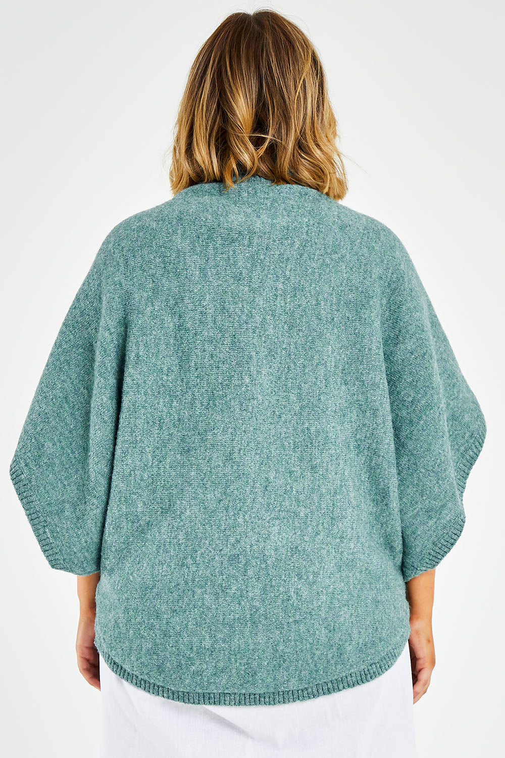 Model Jess wearing size L of the Addicted To You Sweater in colour Sea (Blue), from the back