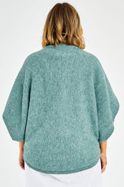 Model Jess wearing size L of the Addicted To You Sweater in colour Sea (Blue), from the back