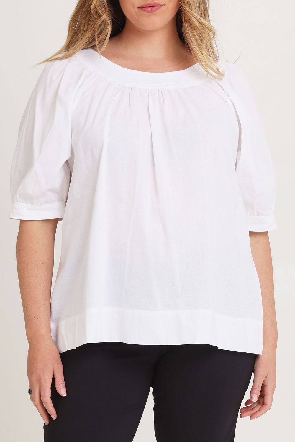 Model Chanel wearing size 16 of the Bliss Top in colour White (White), from the front, cropped image