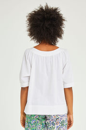 Model Olivia wearing size 10 of the Bliss Top in colour White (White), from the back