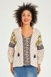 Model Olivia wearing size 10 of the Naina Top in colour Whitelyla (White), from the front, cropped image