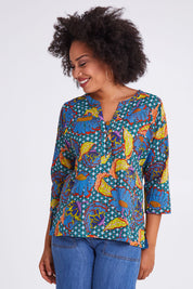 Model Olivia wearing size 10 of the Edith Top in colour Edith (Blue), from the front, cropped image