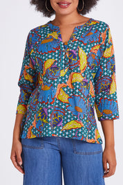 Model Olivia wearing size 10 of the Edith Top in colour Edith (Blue), from the front, cropped image