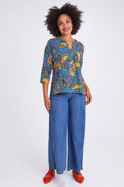 Model Olivia wearing size 10 of the Edith Top in colour Edith (Blue), from the front, showing the whole outfit