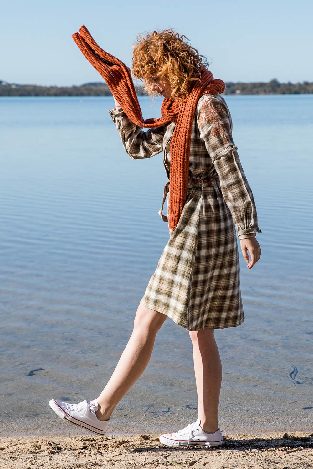 A model wearing size 10 of the Myrtle Dress in colour Banksia (Green), from the front, showing the whole outfit