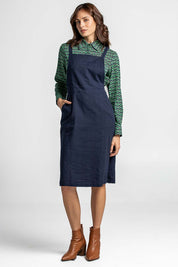 A model wearing the Berty Reversible Tunic in colour Fresconavy (Blue), from the front, showing the whole outfit