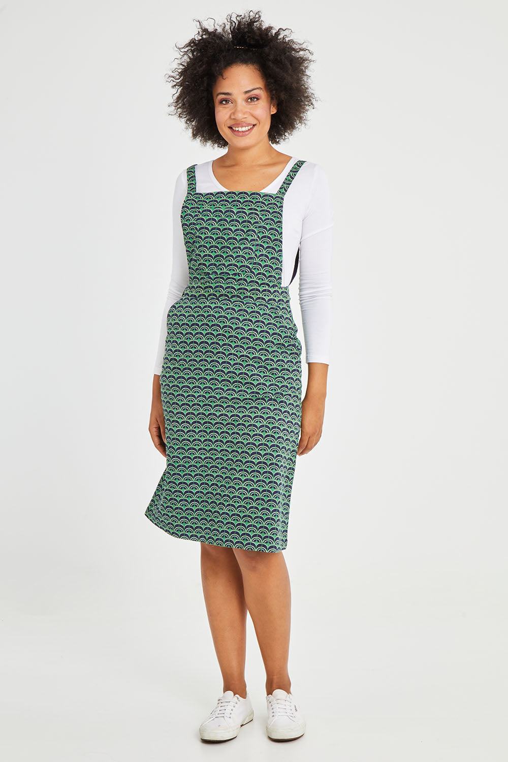 Model Olivia wearing size 10 of the Berty Reversible Tunic in colour Fresconavy (Blue), from the front, showing the whole outfit