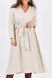 Model Tia wearing size L of the Wildflower Dress in colour NaturalLin, from the front, cropped image