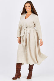 Model Tia wearing size L of the Wildflower Dress in colour NaturalLin, from the front, showing the whole outfit