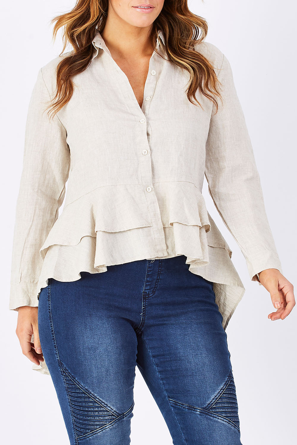 Model Laura wearing size M of the Peplum Top in colour Natural, from the front, cropped image