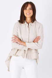 Model Perrie wearing size S of the Peplum Top in colour Natural, from the front, cropped image