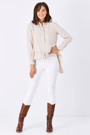 Model Perrie wearing size S of the Peplum Top in colour Natural, from the front, showing the whole outfit